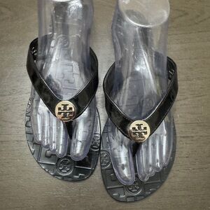 Tory Burch Black Patent Flip Flop Sandals with Gold Logo Medallion